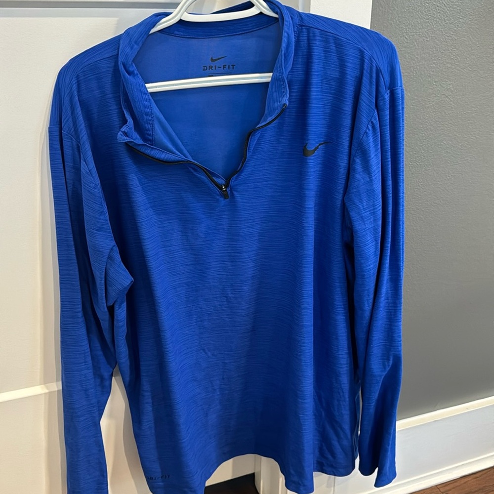 Nike. Men’s, blue pullover w/ zipper.